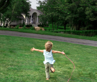 child running in an open field
