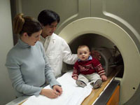 infant and family with MRI scanner