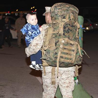 U.S. Marine carrying his son