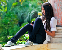 teen girl sitting outside