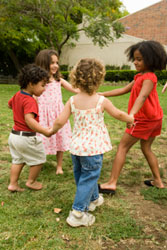 young children playing outdoors
