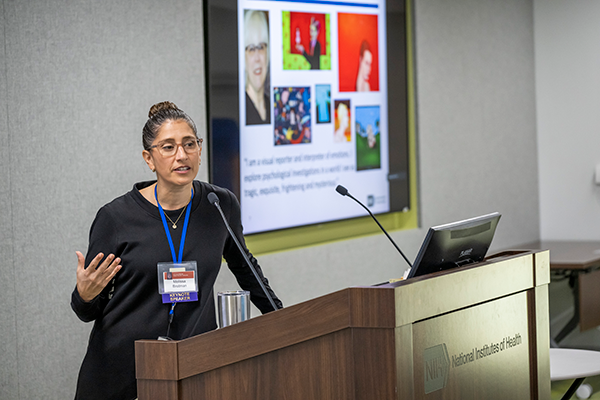 female scientist presenting at a podium