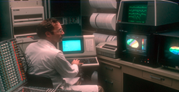 Dr. Richard Coppola studies the brain on computer monitors in 1983.