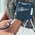 Woman having her blood pressure measured