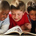 young boys reading book