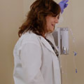 doctor standing by IV pole