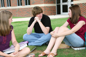 students talking outside