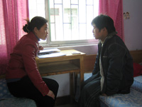 Researcher interviewing with teen study participant