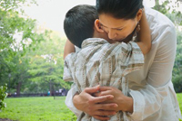 mother and son hugging