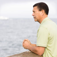 older African American male looking out to sea