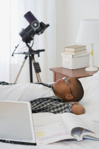 Young boy with telescope