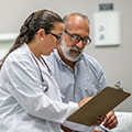 A health care provider talking with a patient
