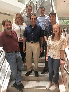 Section on Functional Neuroanatomy Staff Photo standing in group in front of staircase.