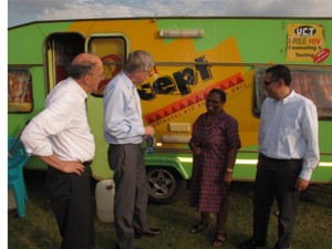 Former NIH Director Francis Collins and others visit a mobile HIV testing van in South Africa used by NIMH Project Accept/HPTN 043. Courtesy of HPTN.