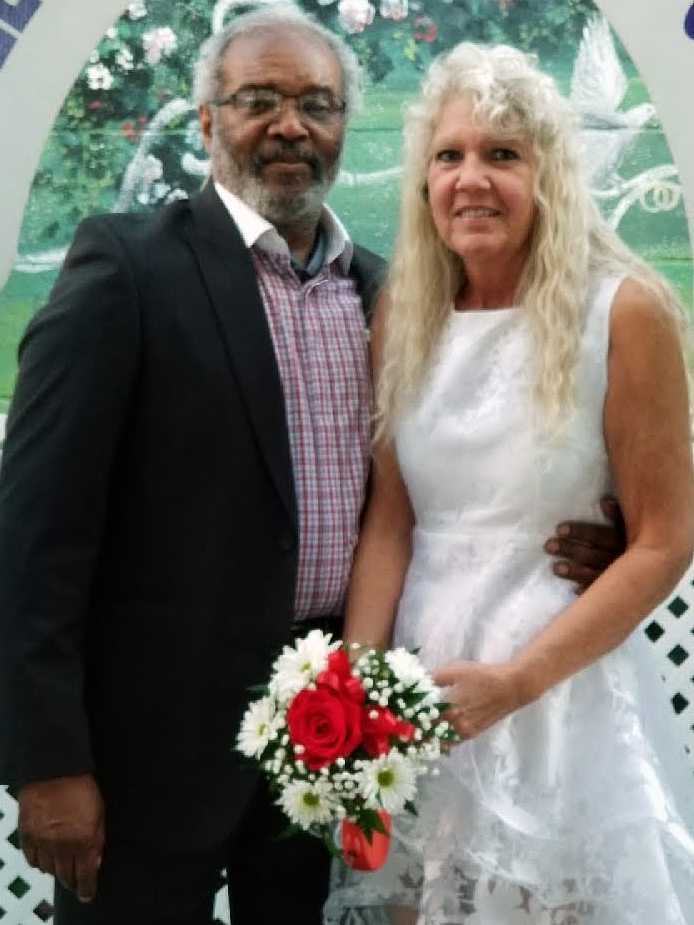 Ray Lay and his wife Dianna pose for a wedding portrait.