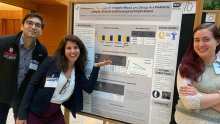 Reut Naim standing in front of her poster with Nakul Aggarwal and Rachel Puralwski at Emotion Symposium Conference in Madison Wisconsin 